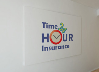 Time 24 Hour Insurance logo printed on the wall